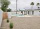 Desert landscaped backyard with a kidney shaped pool, desert plants and a privacy fence at 6401 E Eugie Ter, Scottsdale, AZ 85254