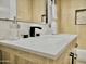 Close-up of the light wood bathroom vanity with marble countertop, black fixtures, and backsplash at 6401 E Eugie Ter, Scottsdale, AZ 85254