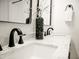 The bathroom features double sinks, marble counters, and modern black fixtures at 6401 E Eugie Ter, Scottsdale, AZ 85254