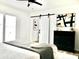 Bright primary bedroom with barn door to bathroom, modern art, and sliding glass door offers comfort and style at 6401 E Eugie Ter, Scottsdale, AZ 85254