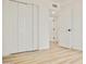 Spacious bedroom showcases bi-fold closet doors and a stylish light wood floor at 6401 E Eugie Ter, Scottsdale, AZ 85254