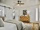 Primary bedroom featuring a barn door to ensuite bath at 6401 E Eugie Ter, Scottsdale, AZ 85254