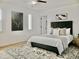 The bedroom features a large bed, ceiling fan, and decor at 6401 E Eugie Ter, Scottsdale, AZ 85254
