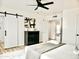 Bright primary bedroom with barn door leading to bathroom and well-appointed furnishings providing style and comfort at 6401 E Eugie Ter, Scottsdale, AZ 85254