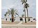 Charming single-story home featuring desert landscaping, palm trees, and a red tile roof at 6401 E Eugie Ter, Scottsdale, AZ 85254