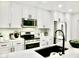 Kitchen featuring white cabinets, stainless steel appliances, and subway tile backsplash at 6401 E Eugie Ter, Scottsdale, AZ 85254
