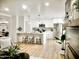 Modern kitchen with stainless steel appliances, white cabinets, and a breakfast bar at 6401 E Eugie Ter, Scottsdale, AZ 85254