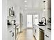 Bright kitchen with white cabinetry, stainless appliances, and access to the outdoor area at 6401 E Eugie Ter, Scottsdale, AZ 85254
