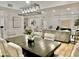 Inviting living space with a large dining table, stylish sofa, and an open floor plan at 6401 E Eugie Ter, Scottsdale, AZ 85254