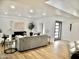 Spacious living room with modern lighting, sleek decor, wood flooring and comfortable seating at 6401 E Eugie Ter, Scottsdale, AZ 85254