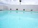 Inviting swimming pool with clear blue water and white privacy fence at 6401 E Eugie Ter, Scottsdale, AZ 85254