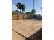 The property features a large, empty backyard with a wooden fence, offering privacy and potential for customization at 8307 W Indianola Ave, Phoenix, AZ 85037