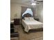 A well-lit bedroom with a ceiling fan and ample closet space, combining comfort and functionality at 8307 W Indianola Ave, Phoenix, AZ 85037