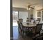 The dining room boasts stylish seating for six under a ceiling fan at 8307 W Indianola Ave, Phoenix, AZ 85037