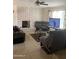 Open concept living room features a white brick fireplace and comfortable seating at 8307 W Indianola Ave, Phoenix, AZ 85037