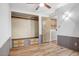 Bedroom featuring modern flooring, a built-in closet, and easy access to the laundry room at 853 S Evangeline Ave, Mesa, AZ 85208