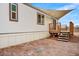 View of a home exterior, featuring a porch with wood railing and steps at 853 S Evangeline Ave, Mesa, AZ 85208