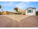 Manufactured home featuring a large carport and low maintenance landscaping at 853 S Evangeline Ave, Mesa, AZ 85208