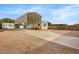 Manufactured home featuring a large carport, wood steps, and low maintenance landscaping at 853 S Evangeline Ave, Mesa, AZ 85208