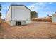 View of the home's exterior, including the A/C and small shed at 853 S Evangeline Ave, Mesa, AZ 85208