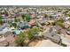 Aerial view of a neighborhood with many single-Gathering homes and backyard pools at 8912 W Sheridan St, Phoenix, AZ 85037