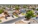 Aerial view of a neighborhood showcasing various homes, some with pools and solar panels at 8912 W Sheridan St, Phoenix, AZ 85037