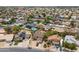 An aerial view showcasing a neighborhood with houses, pools, and tree-lined streets at 8912 W Sheridan St, Phoenix, AZ 85037