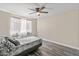 Cozy bedroom featuring a ceiling fan, natural light, and a neutral color palette at 8912 W Sheridan St, Phoenix, AZ 85037