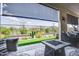 Inviting covered back patio with a desert-landscaped yard, perfect for outdoor relaxation and entertainment at 11249 N Blakely St, Surprise, AZ 85388