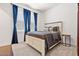Charming bedroom with a cozy carpet, neutral walls, and blue curtains for a calming aesthetic at 11249 N Blakely St, Surprise, AZ 85388
