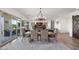 Bright dining area featuring a chandelier, rug, and view to patio at 11249 N Blakely St, Surprise, AZ 85388