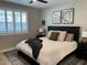 Cozy bedroom with large window, comfortable bed, and patterned rug at 11403 W Ashby Dr, Peoria, AZ 85383