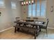Dining room features a wooden table, six chairs and modern lighting fixture at 11403 W Ashby Dr, Peoria, AZ 85383