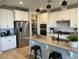 Modern kitchen with granite counters, stainless steel appliances and black hardware at 11403 W Ashby Dr, Peoria, AZ 85383