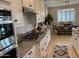 Modern kitchen with granite countertops, stainless appliances, and gas range at 11403 W Ashby Dr, Peoria, AZ 85383