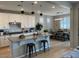 Bright kitchen features white cabinets, granite countertops, stainless steel appliances and an island at 11403 W Ashby Dr, Peoria, AZ 85383