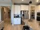Modern kitchen features white cabinets, granite countertops, stainless steel appliances, and a pantry at 11403 W Ashby Dr, Peoria, AZ 85383