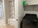 Laundry room featuring built-in storage and modern appliances for efficient laundry tasks at 11403 W Ashby Dr, Peoria, AZ 85383