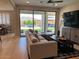 Open-concept living room with access to the outdoor living space and well-manicured backyard at 11403 W Ashby Dr, Peoria, AZ 85383