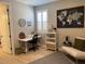 Home office space with a desk, chair, shelving, and a large world map creating an ideal workspace at 11403 W Ashby Dr, Peoria, AZ 85383