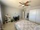 Comfortable bedroom with a ceiling fan, and a work desk at 11906 N 154Th N Ln, Surprise, AZ 85379