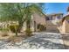 Two-story home features a well-maintained lawn, neutral-toned stucco, and a spacious driveway leading to the garage at 11906 N 154Th N Ln, Surprise, AZ 85379