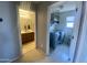 Hallway with a bathroom and laundry room at the end at 11906 N 154Th N Ln, Surprise, AZ 85379