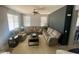 Neutral-colored living room with large windows and plush, comfortable seating, creating a cozy gathering space at 11906 N 154Th N Ln, Surprise, AZ 85379