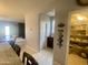 Walk-in pantry features ample shelving, great for storage and organization and located adjacent to kitchen at 11906 N 154Th N Ln, Surprise, AZ 85379
