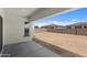 Expansive backyard featuring desert landscaping and a covered patio, perfect for outdoor relaxation at 12332 W Parkway Ln, Avondale, AZ 85323
