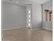 Cozy bedroom featuring tile flooring, a large window, and a modern door at 12332 W Parkway Ln, Avondale, AZ 85323