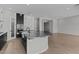 Elegant kitchen featuring a marble island, modern appliances, and sleek black and white cabinets at 12332 W Parkway Ln, Avondale, AZ 85323