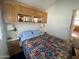 Bedroom with bed, cabinets, and nightstands at 1318 W Chesapeake Dr, Apache Junction, AZ 85119