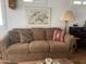 Living room with patterned pillows, brown couch, and artwork on the wall at 1318 W Chesapeake Dr, Apache Junction, AZ 85119